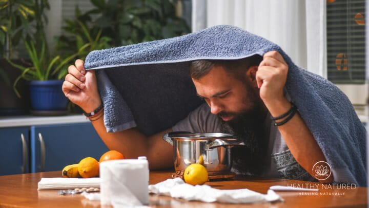 a man using steam and herbs to clear congestion