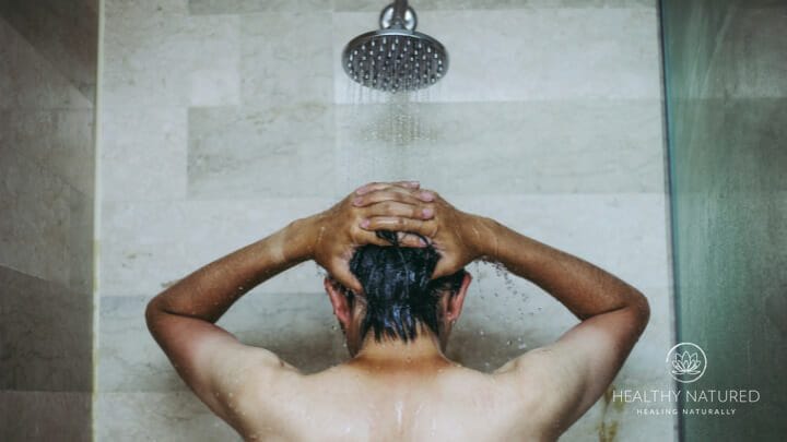 A man having a shower to clear congestion