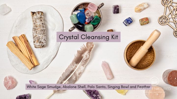 crystal cleansing kit with white sage smudge, abalone shell, palo santo, singing bowl and feather