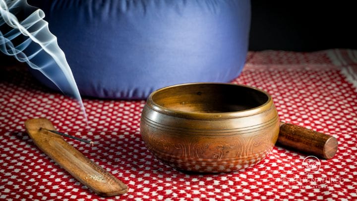 meditation guide sound bowl, incense and meditation cushion