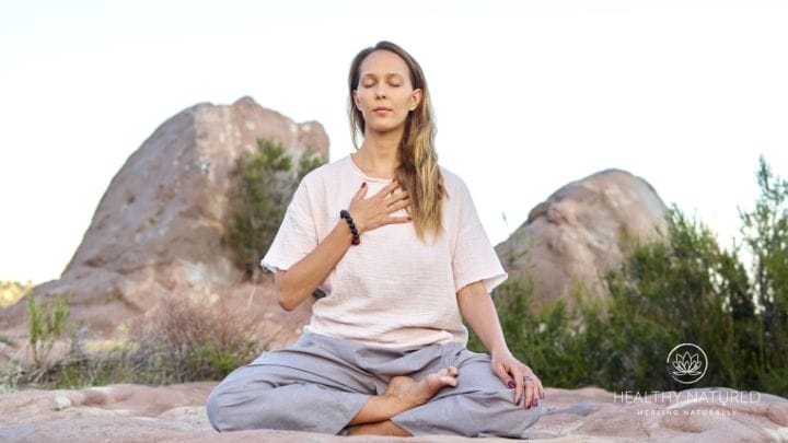 a woman practicing loving kindness meditation